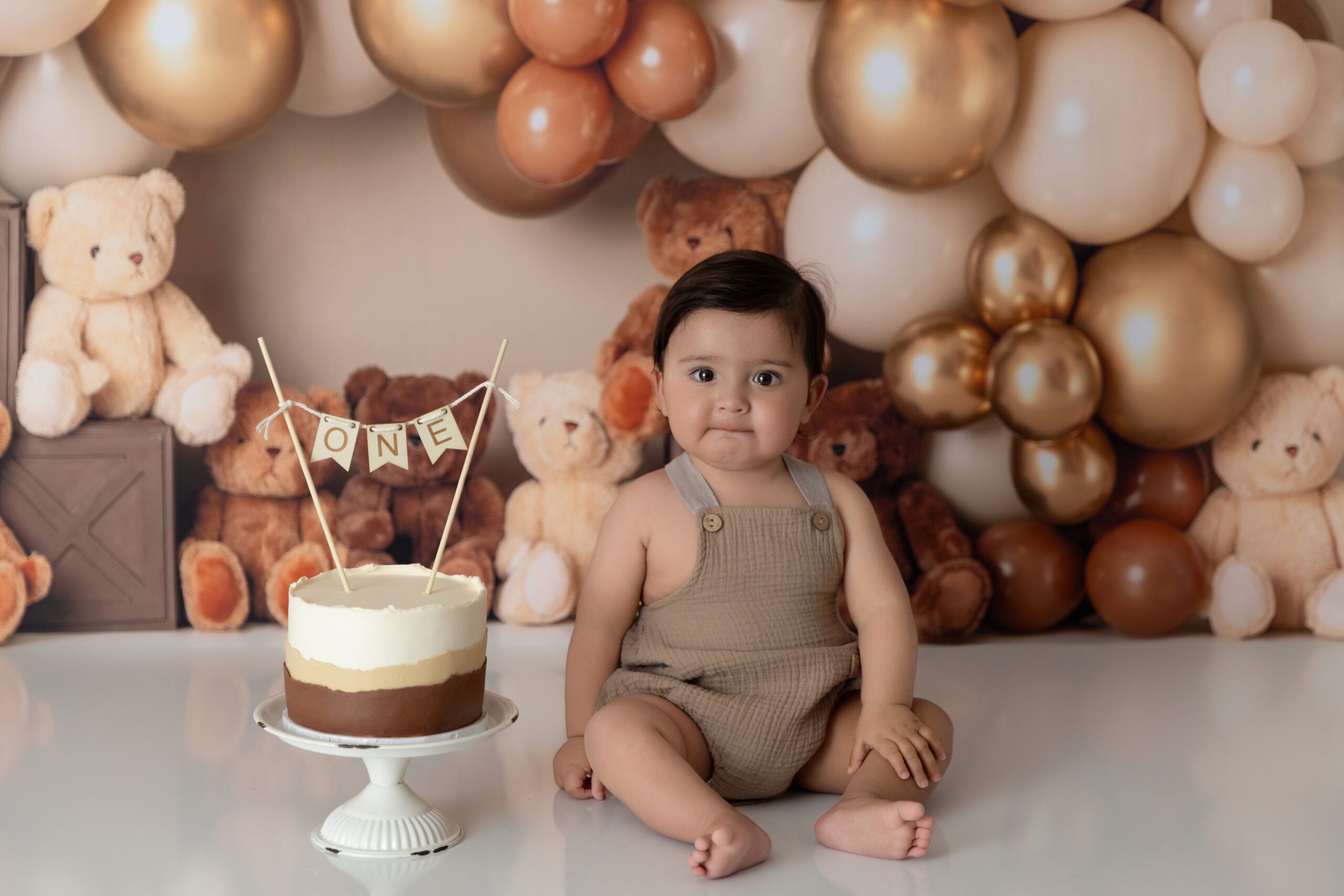 Cake smash session with a baby boy photographed in studio by a West Island baby photographer