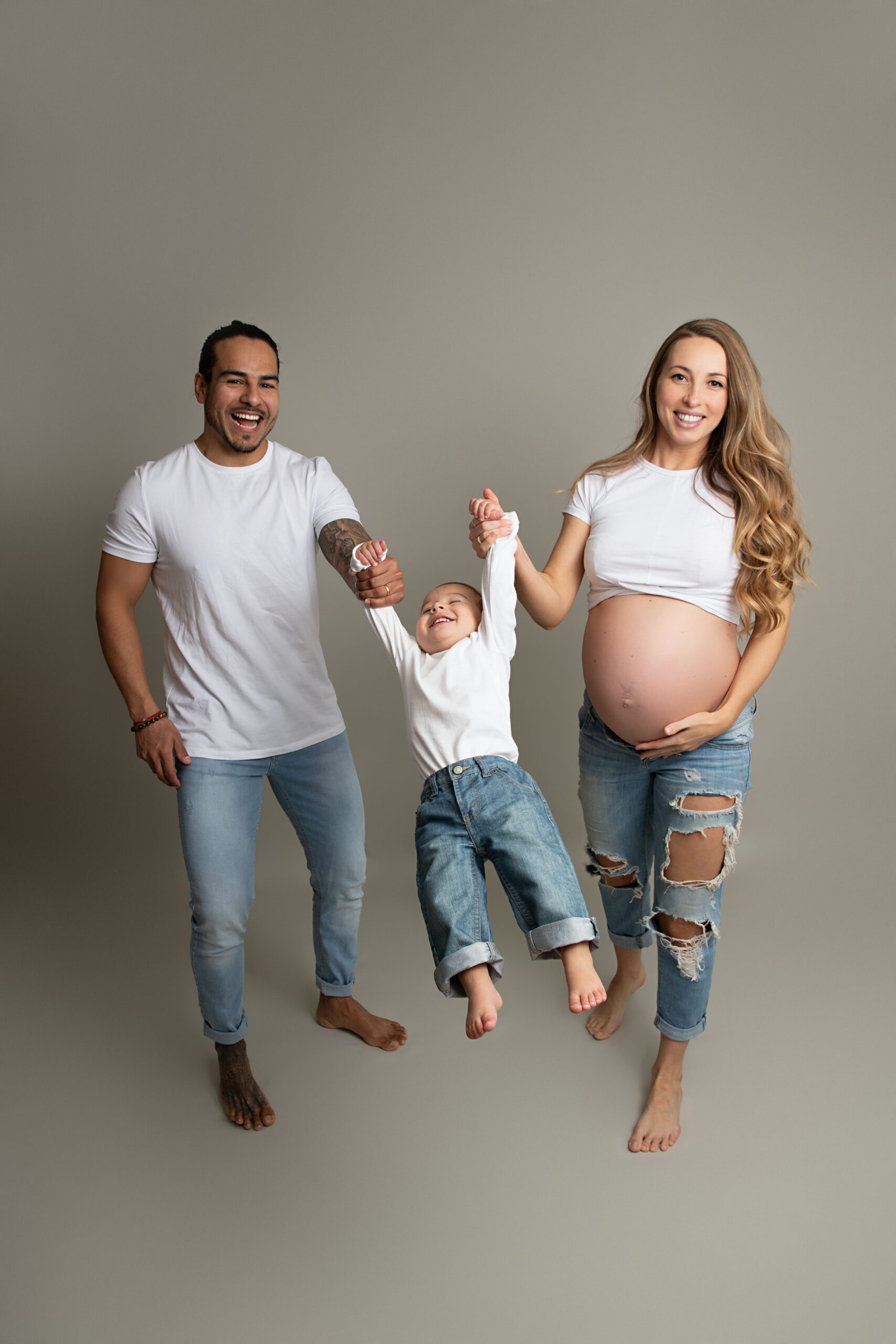 Family maternity portrait photographed in studio by a West Island maternity photography specialist